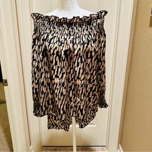 Black and tan hi low off the shoulder shirt.